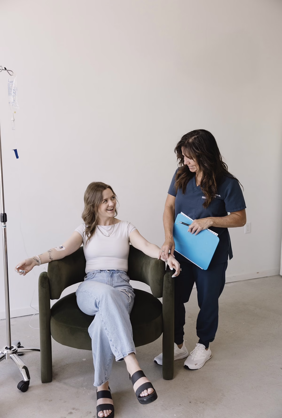 Woman getting a consultation for IV Infusion drip in St Albert from IV Infusions by Can Occ Wellness 1200