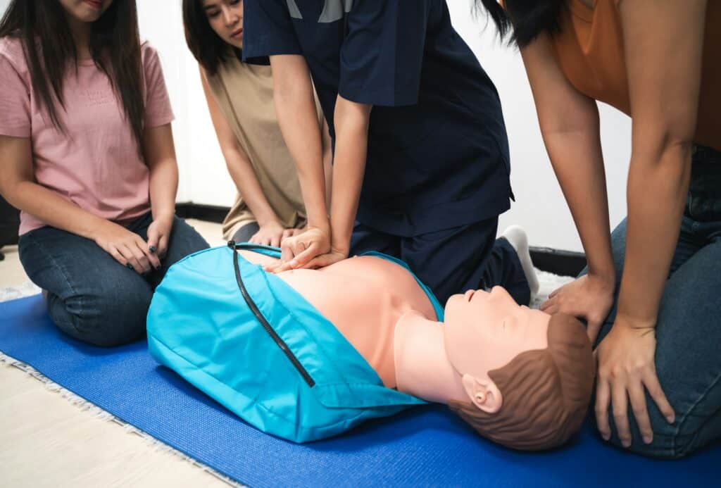 CPR Training ,Emergency and first aid class on cpr doll, Cardiopulmonary resuscitation